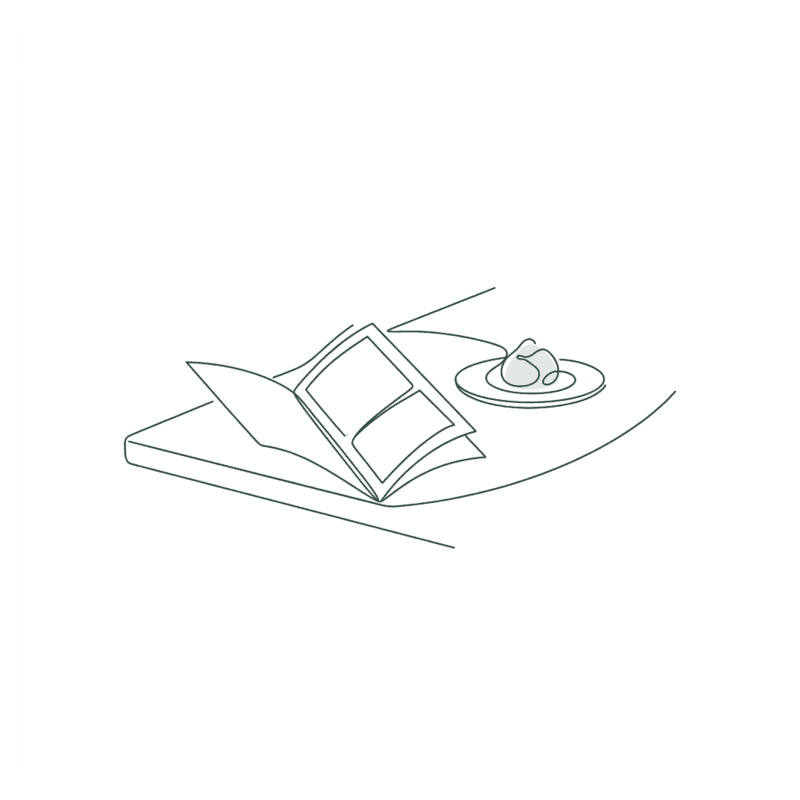 Line illustration of an open menu and a plate on a counter